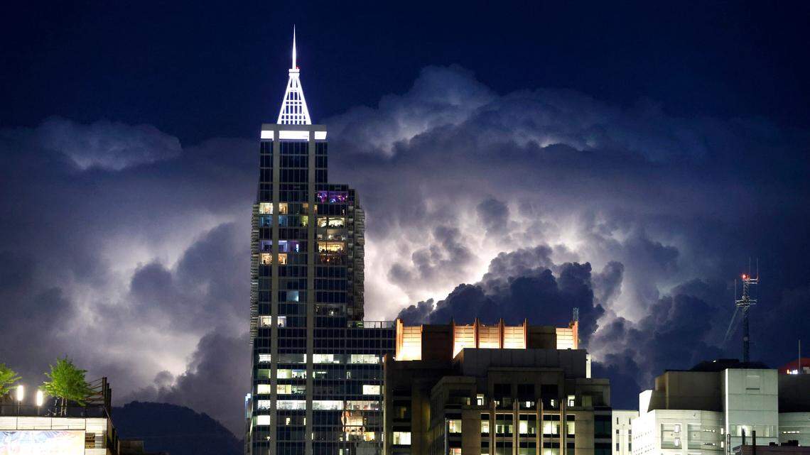 Storms light up the sky east of downtown Raleigh, N.C., Friday evening, April 28, 2023. More storms are expected Saturday.