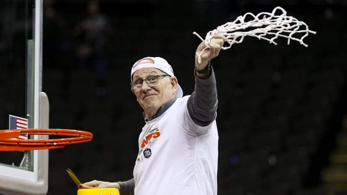 Miami Hurricanes head coach Jim Larranaga cuts down the net after defeating the Texas Longhorns at the T-Mobile Center.