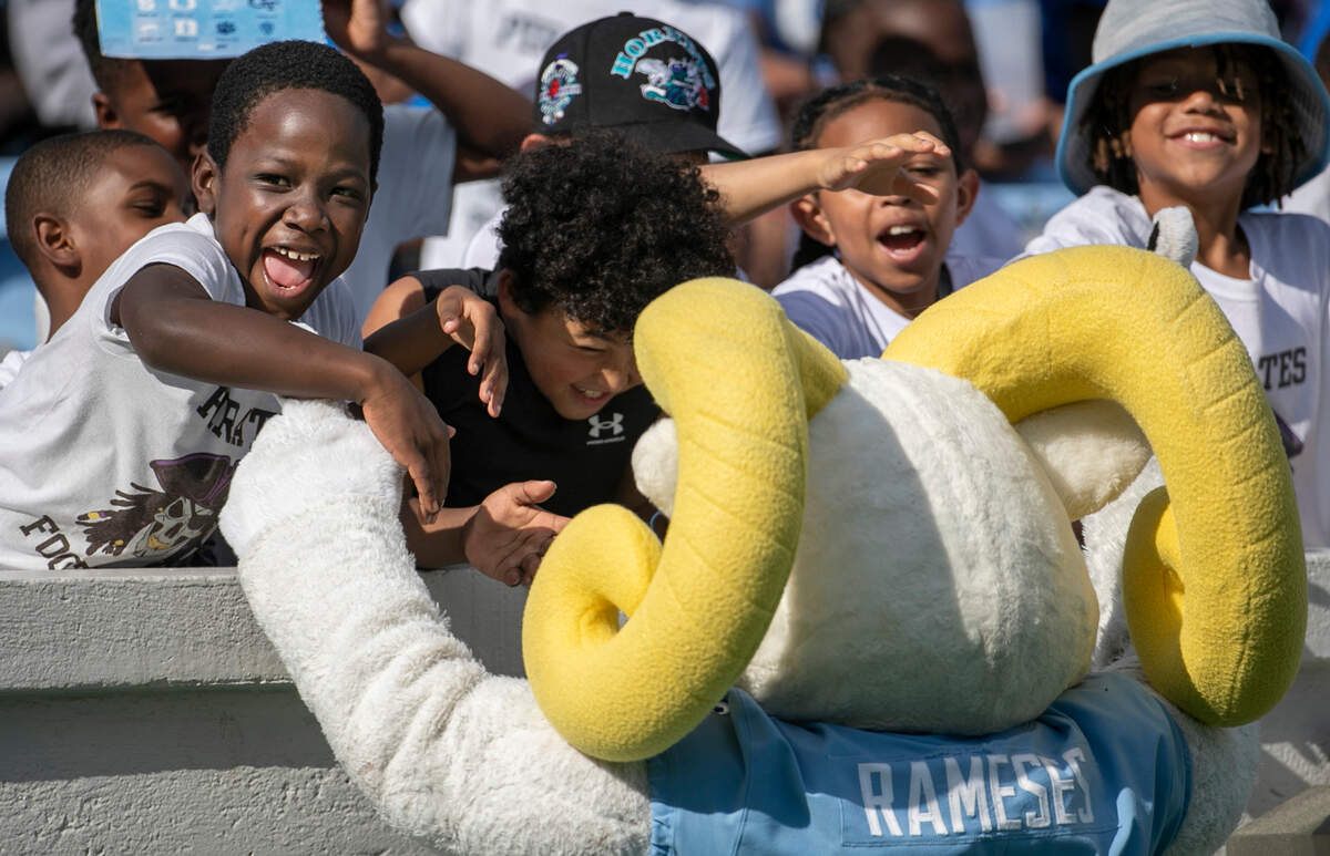 North Carolina’s mascot Rameses, is greeted by a group of children during the Tar Heels’ spring football game on Saturday April 15, 2023 at even Stadium in Chapel Hill, N.C.