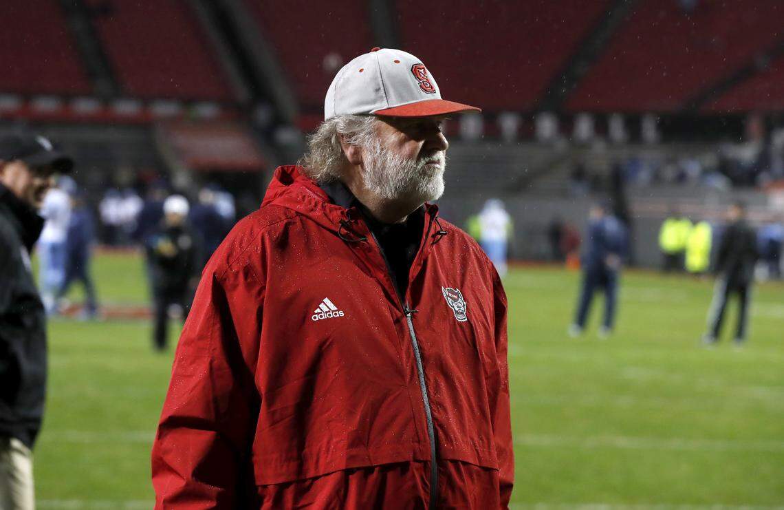 N.C. State defensive coordinator Dave Huxtable watches as the team warms up before N.C. State’s game against UNC at Carter-Finley Stadium in Raleigh, N.C., Saturday, November 30, 2019.