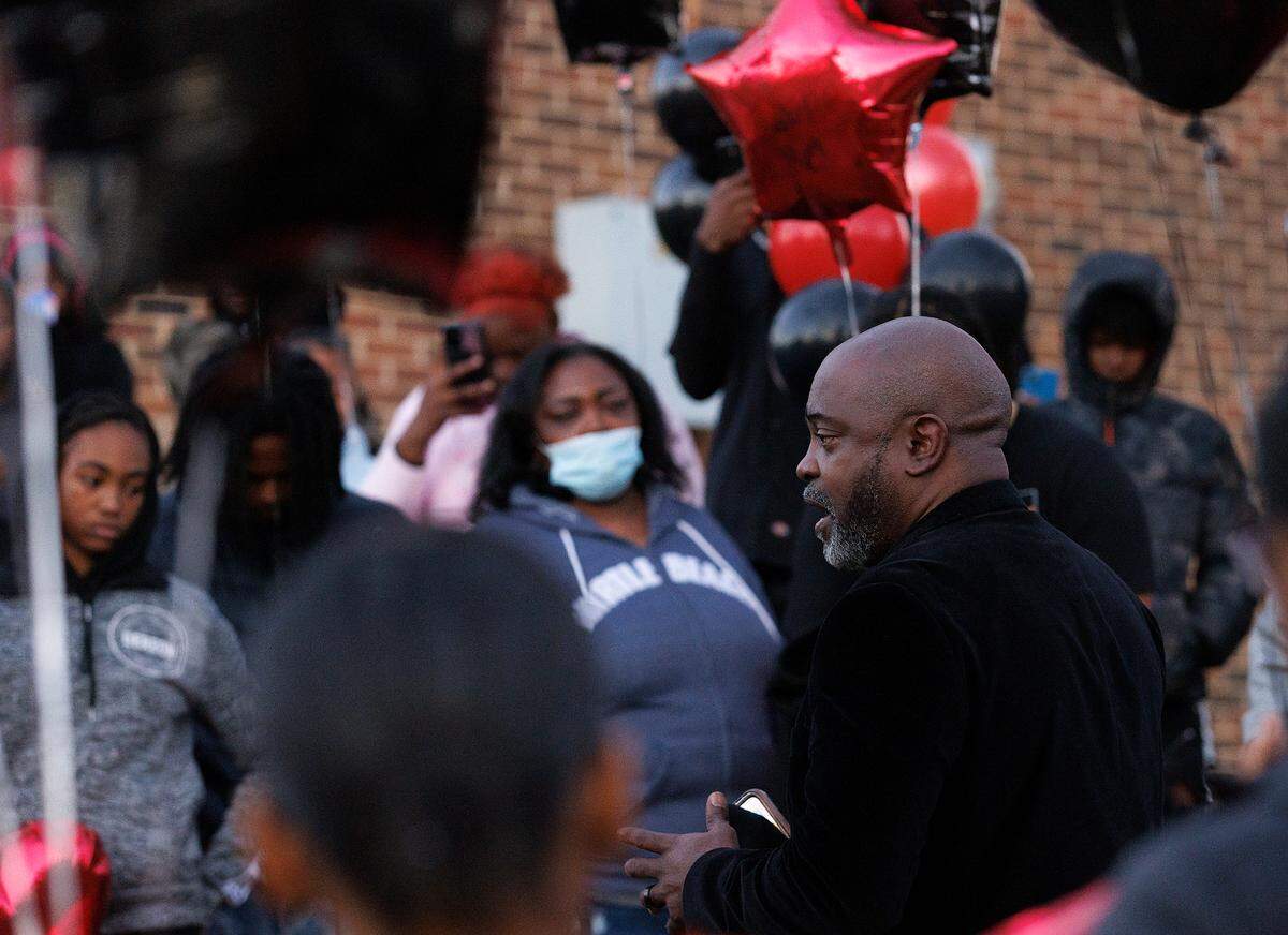 Rev. Wilbert Davis of Glorious Church of God speaks prior to a balloon release in honor of Delvin Ferrell on Wednesday, Nov. 29, 2023, in Raleigh, N.C. Ferrell, 15, died after being stabbed on Monday at Southeast Raleigh High School.