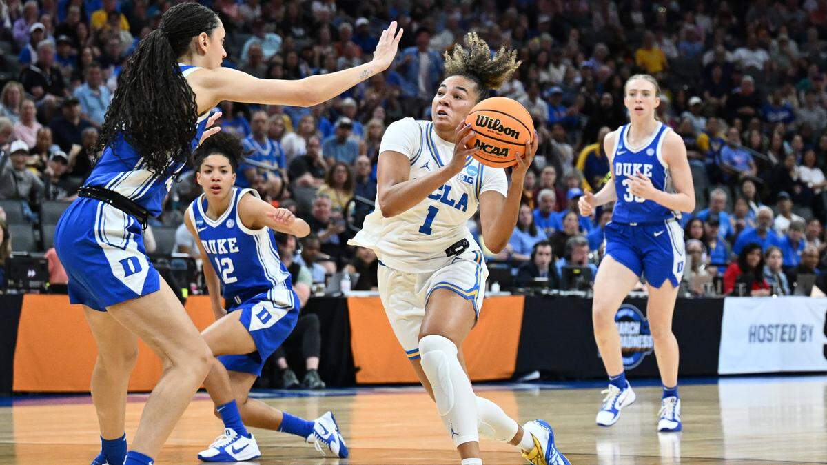 UCLA’s Kiki Rice (1) drives to the basket against Jordan Wood of Duke during the second quarter in the teams’ Elite Eight game at the 2026 NCAA Women’s Basketball Tournament at Golden 1 Center on March 29, 2026 in Sacramento, California.