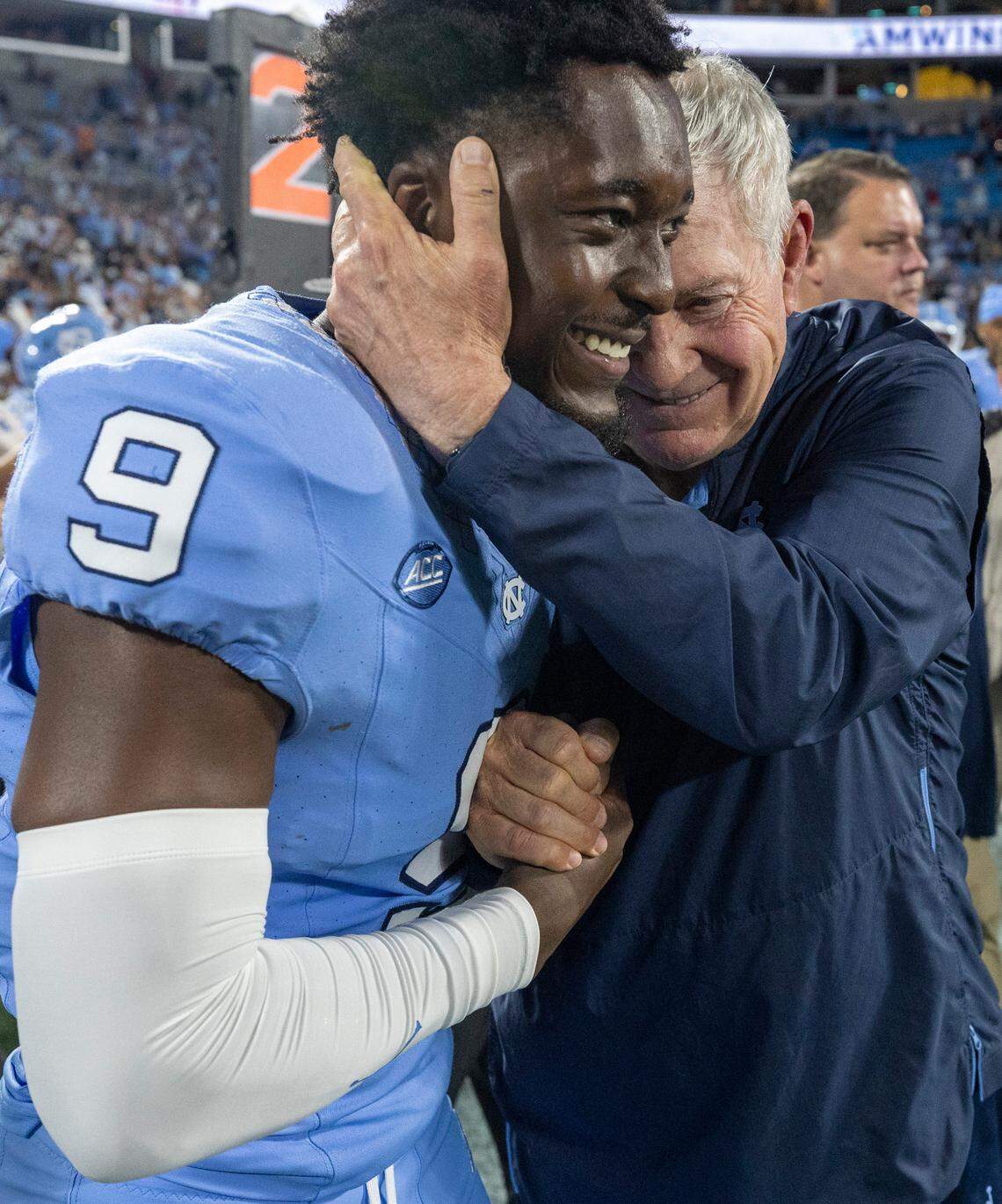 North Carolina coach Mack Brown embraces Armani Chapman (9) following the Tar Heels’ 31-17 victory over South Carolina on Saturday September 2, 2023 at Bank of America Stadium in Charlotte, N.C.