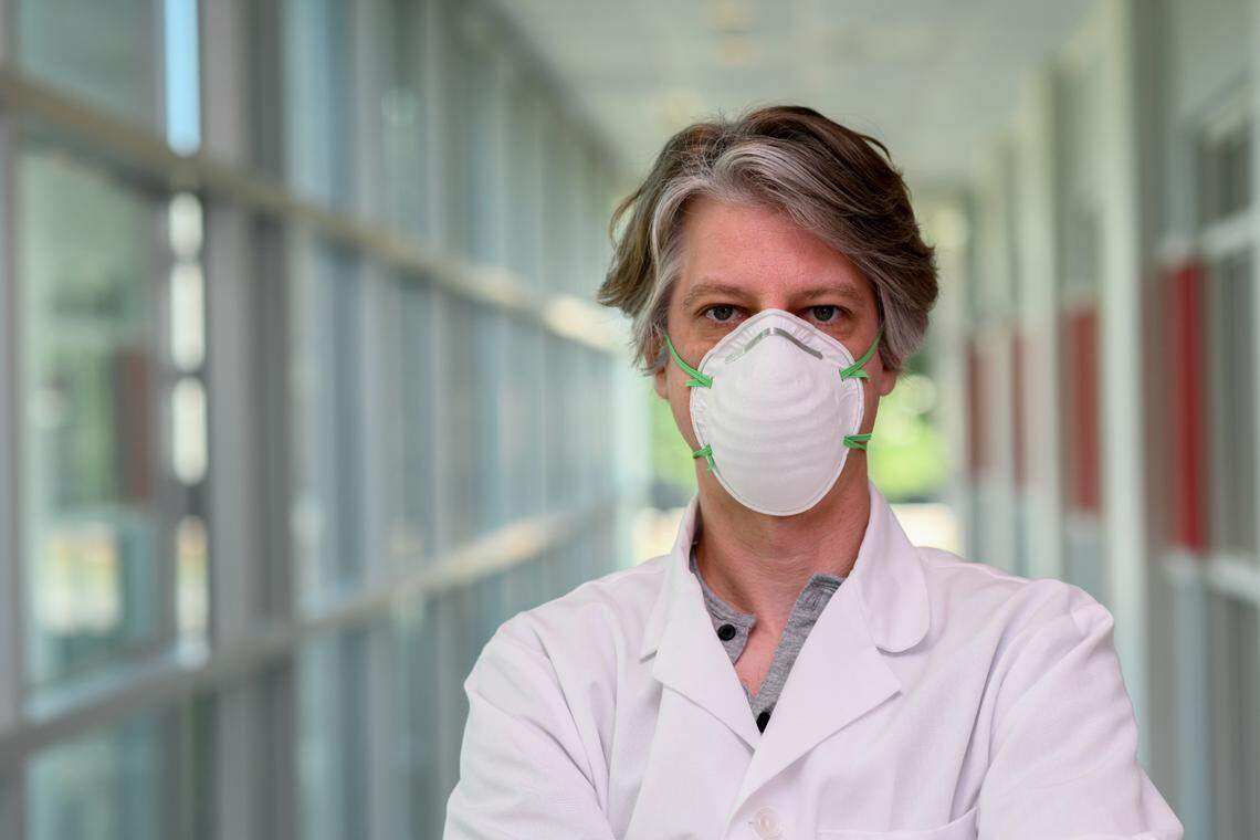 An example of an N95 mask is shown being worn on a person.