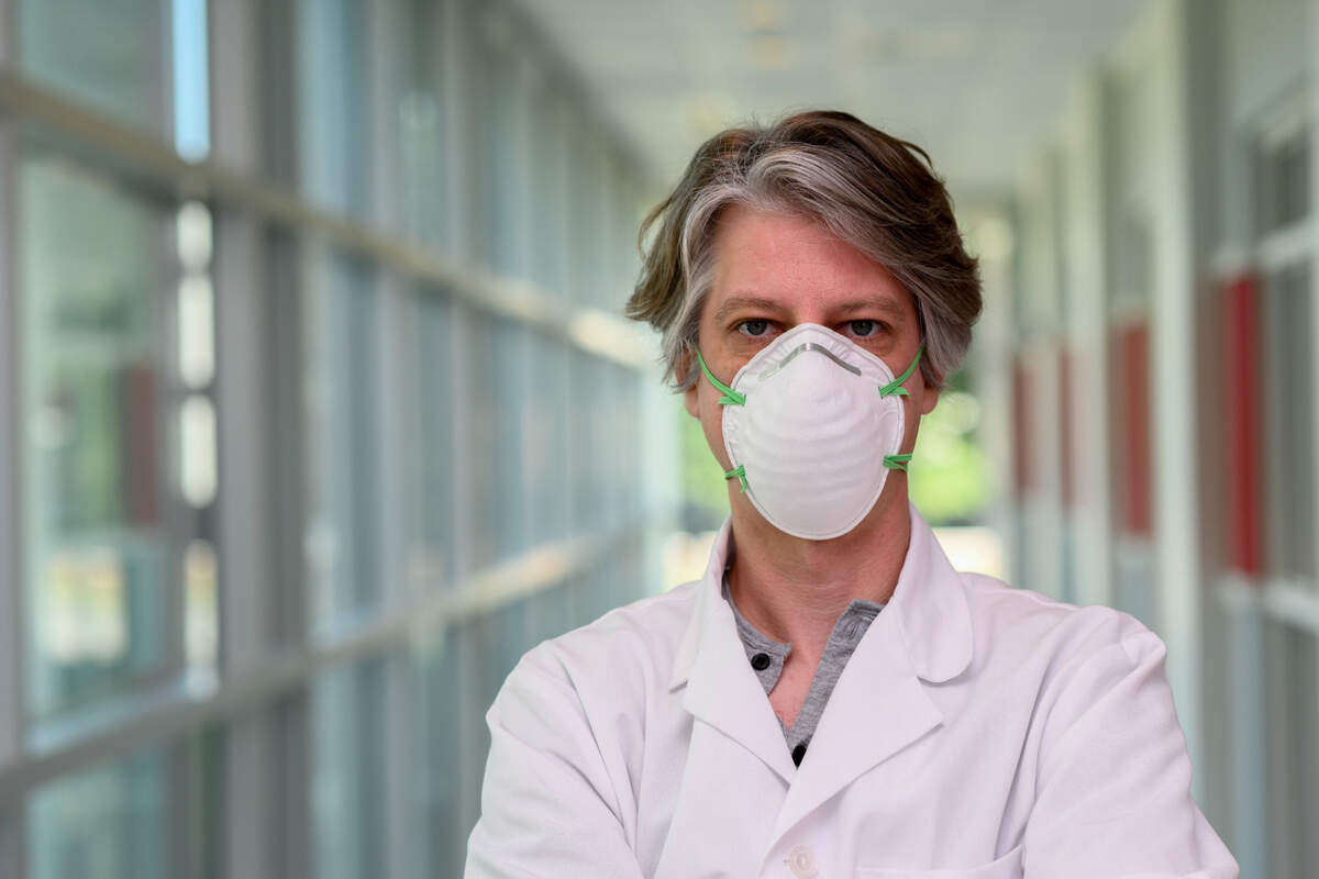 An example of an N95 mask is shown being worn on a person.