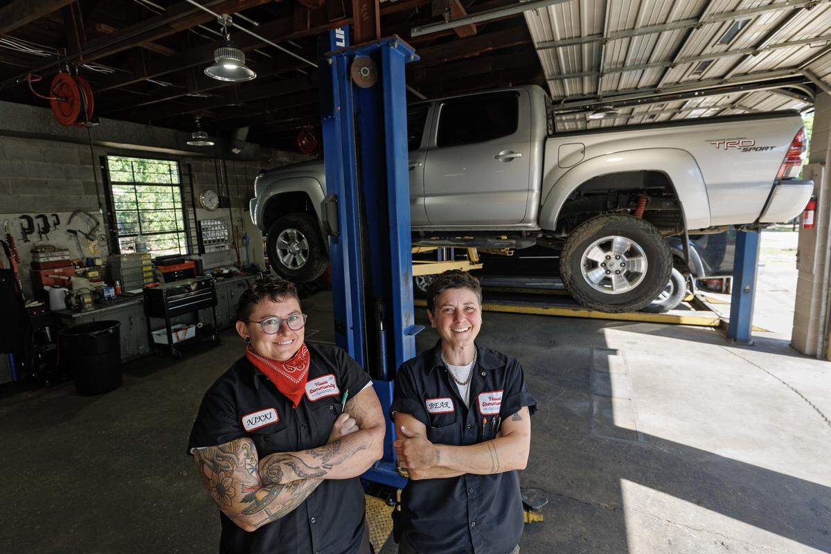 Nikki Puckett and Bear O’Brien, co-owners of Fluid Community Garage, pose for a portrait on Thursday, April 23, 2026, in Durham, N.C.