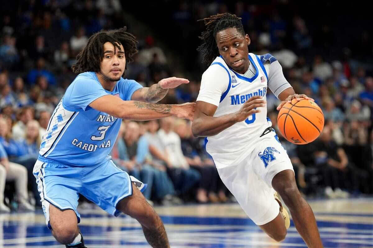 North Carolina’s Elliot Cadeau defends Memphis’ Baraka Okojie (6) during the game between UNC and Memphis in the Hoops for St. Jude Tip Off Classic at FedExForum on Tuesday, October 15, 2024.
