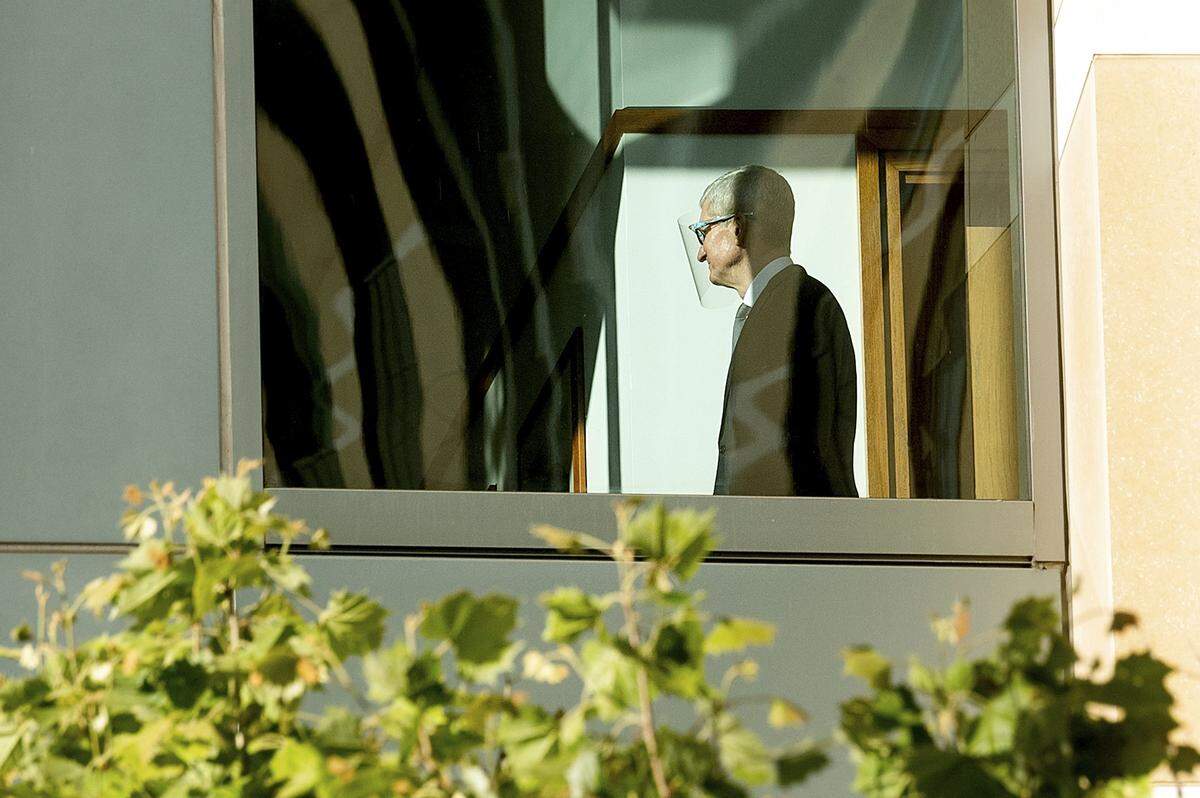 Apple CEO Tim Cook walks through the Ronald V. Dellums building, Friday, May 21, 2021, in Oakland, Calif. Cook is expected to take the witness stand Friday to defend the company’s iPhone app store against charges that it has grown into an illegal monopoly — one far more profitable than his predecessor Steve Jobs envisioned when it opened up 13 years ago.