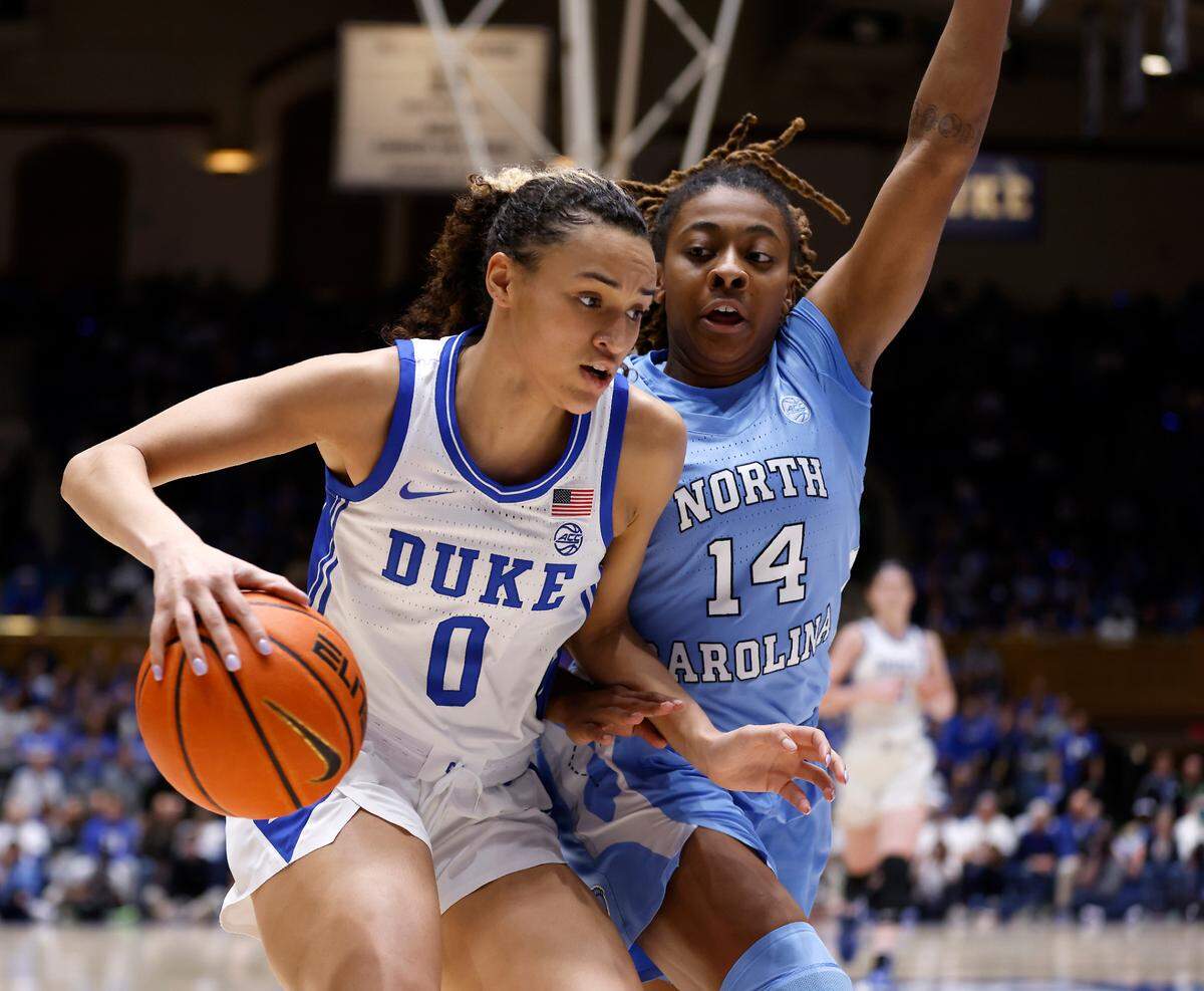 Duke’s Celeste Taylor drives past North Carolina’s Kayla McPherson during the first half of the Tar Heels’ 45-41 win over Duke on Sunday, Feb. 26, 2023, at Cameron Indoor Stadium in Durham, N.C.