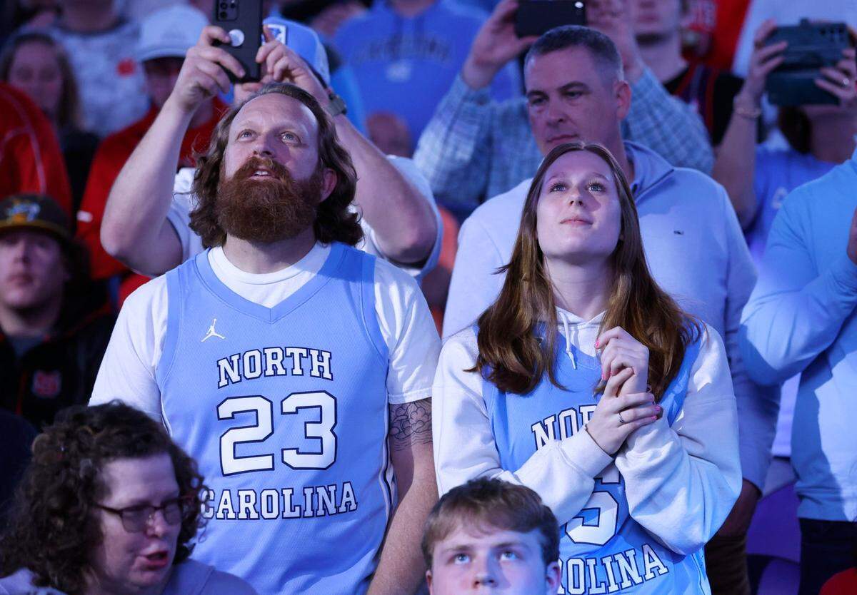 North Carolina fans watch the introductions before UNC’s game against Boston College in the second round of the New York Life ACC Men’s Basketball Tournament in Greensboro, N.C., Wednesday, March 8, 2023.