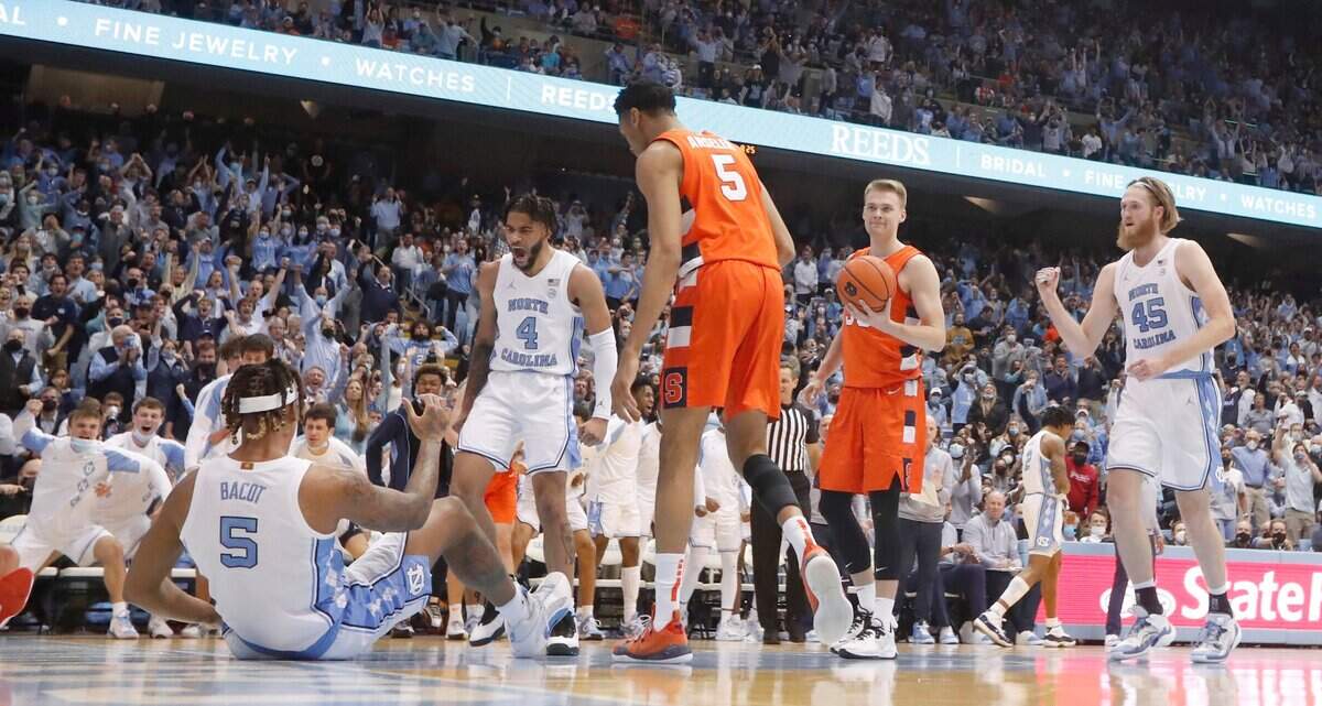 North Carolina’s R.J. Davis (4) celebrates with Armando Bacot (5) after Bacot made the shot while being fouled during UNCs 88-79 overtime victory over Syracuse at the Smith Center in Chapel Hill, N.C., Monday, Feb. 28, 2022.