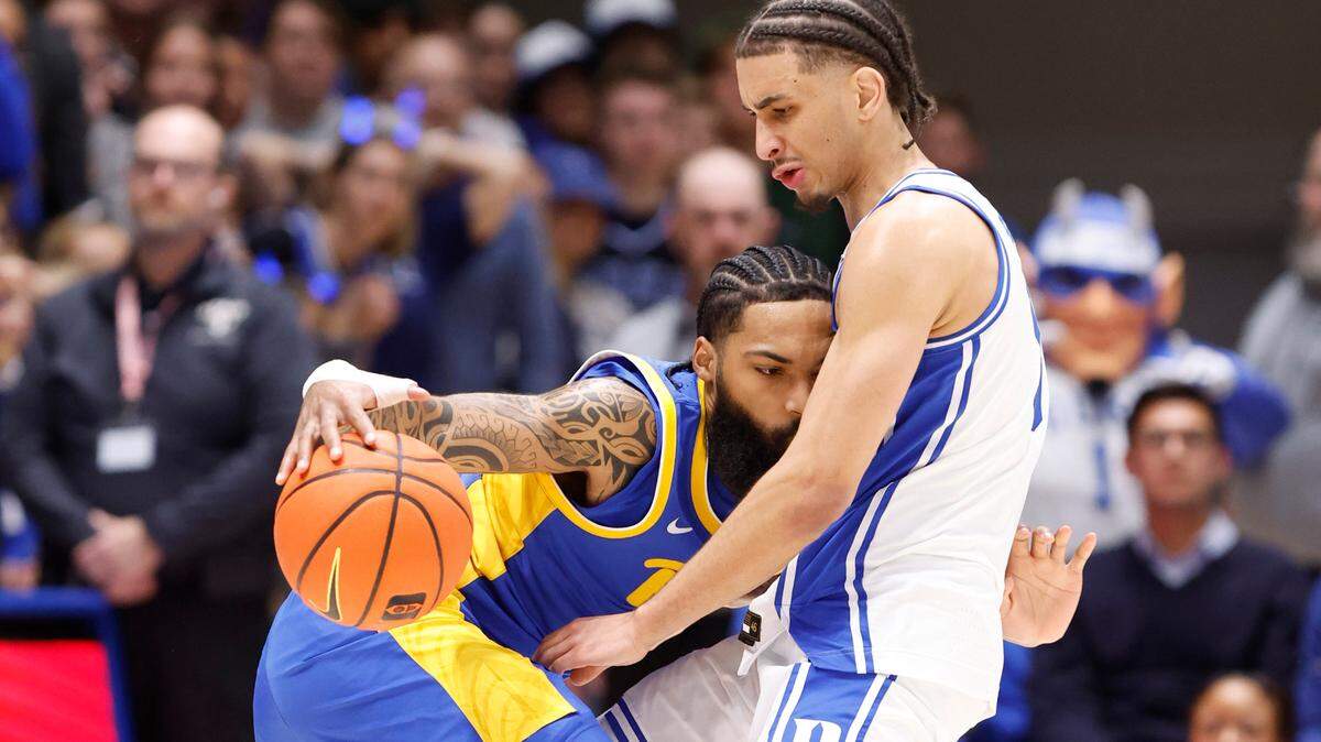 Duke’s Tyrese Proctor (5) defends Pittsburgh’s Damian Dunn (1) during the second half of Duke’s 76-47 victory over Pitt at Cameron Indoor Stadium in Durham, N.C., Tuesday, Jan. 7, 2025.