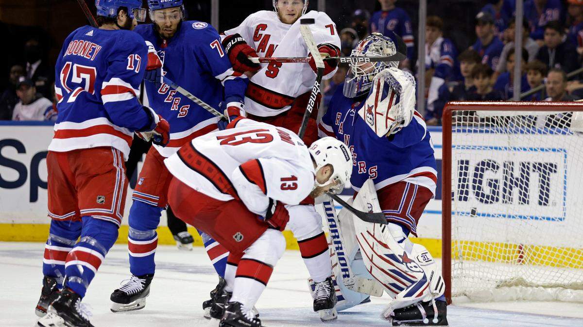 New York Rangers goaltender Igor Shesterkin (31) defends a deflection by Carolina Hurricanes defenseman Brady Skjei (76) during the second period of Game 3 of an NHL hockey Stanley Cup second-round playoff series, Sunday, May 22, 2022, in New York. (AP Photo/Adam Hunger)