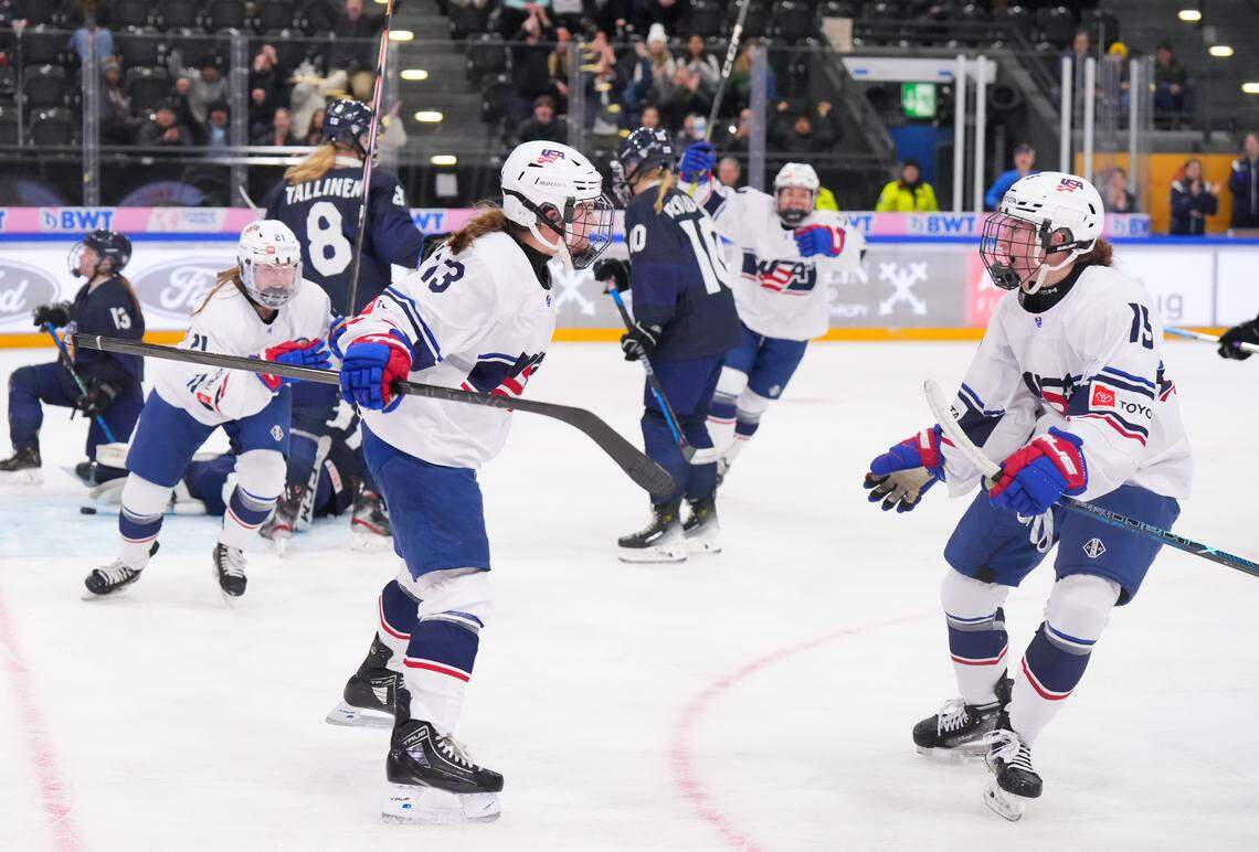 Raleigh’s Mary Derrenbacher (13) celebrates with Ava Thomas (15) after scoring for the United States against Finland during Semifinal Round action at the 2024 IIHF U18 Women’s World Championship in Switzerland in January.