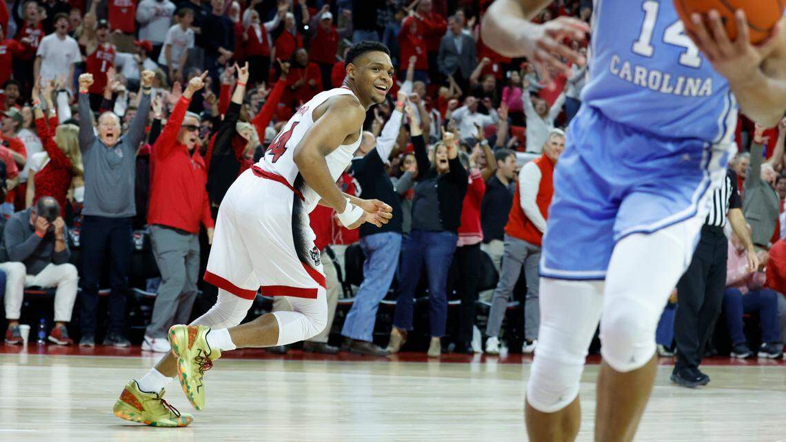 N.C. State’s Casey Morsell (14) heads back upcourt after making the basket in the second half of N.C. State’s 77-69 victory over UNC at PNC Arena in Raleigh, N.C., Sunday, Feb. 19, 2023.