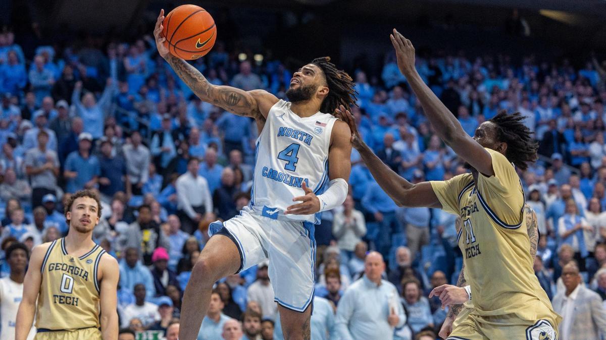 North Carolina guard R.J. Davis (4) breaks to the baskets against Georgia Tech’s Baye Nidongo (11), to give the Tar Heels a four point lead in the second half on Saturday, December 7, 2024 at the Smith Center in Chapel Hill, N.C. Davis scored 16 points in the Tar Heels’ 68-65 victory.