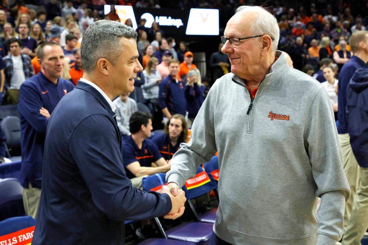 Virginia Cavaliers head coach Tony Bennett shakes hands with Syracuse Orange head coach Jim Boeheim prior to their game at John Paul Jones Arena in January 2023.