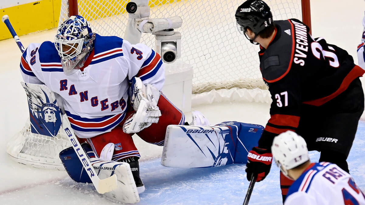Longtime New York Rangers goalie Henrik Lundqvist, seen allowing a goal to Hurricanes forward, Andrei Svechnikov last season, signed a free-agent deal Friday with the Washington Capitals and will stay in the Metropolitan Division. (Frank Gunn/The Canadian Press via AP)