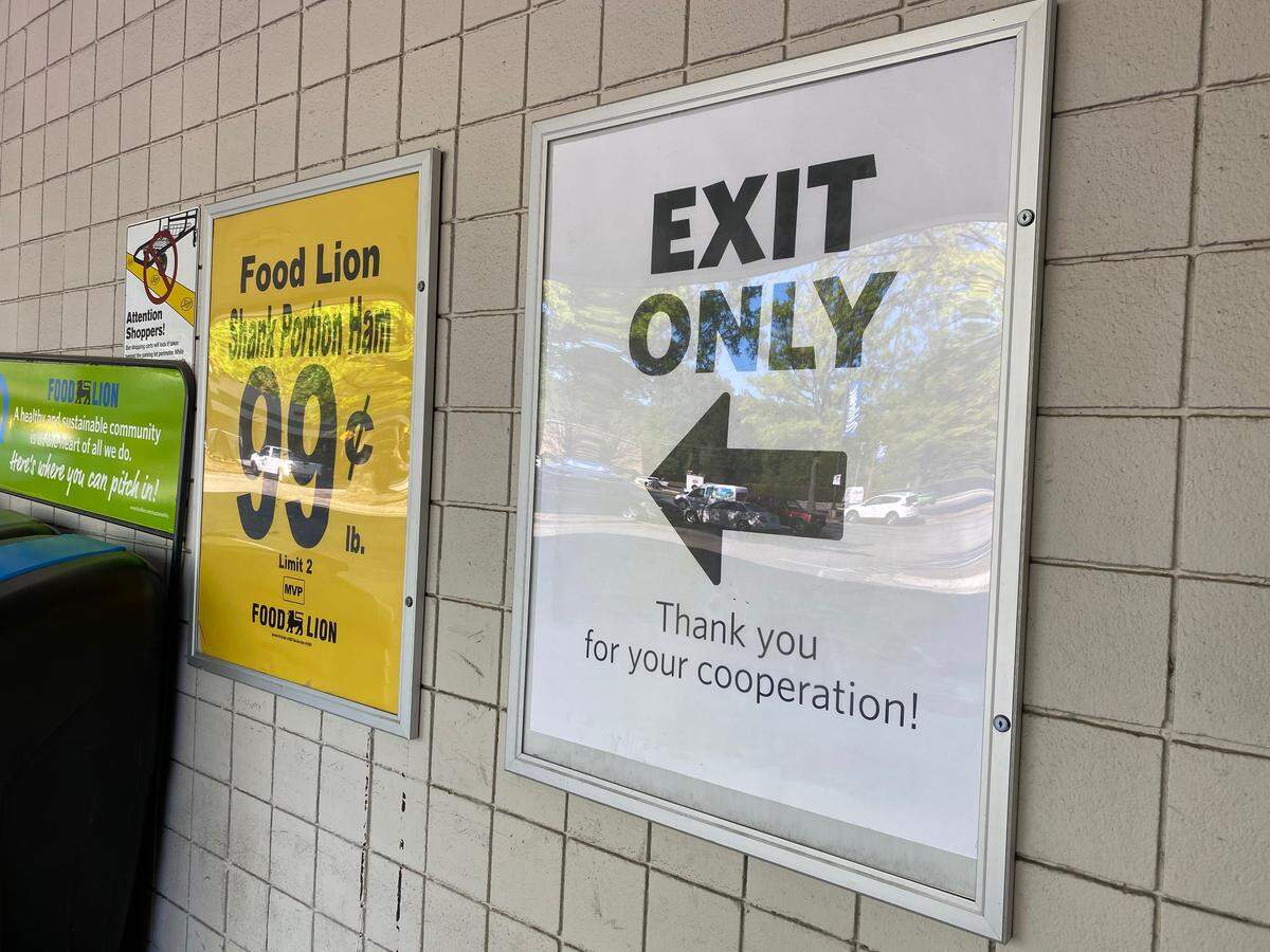 Signs at a Food Lion grocery store on Wycliff Avenue in Raleigh, NC, on Tuesday, April 14, mark dedicated entrances and exits. The one-way entrances and exits were encouraged in a new Executive Order from Gov. Roy Cooper, intended to slow the transmission of COVID-19.