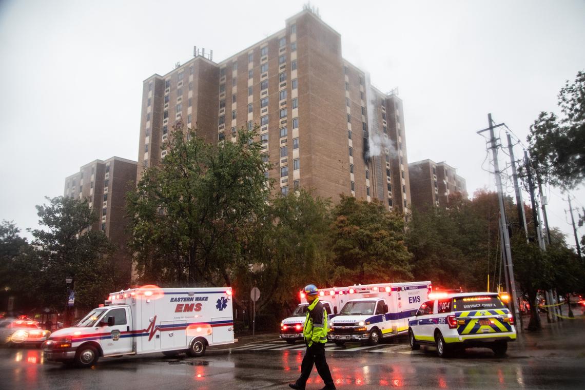 Emergency personnel respond to the scene of an apartment fire at Glenwood Towers, a senior-living complex in downtown Raleigh, Friday, Oct. 26, 2018.
