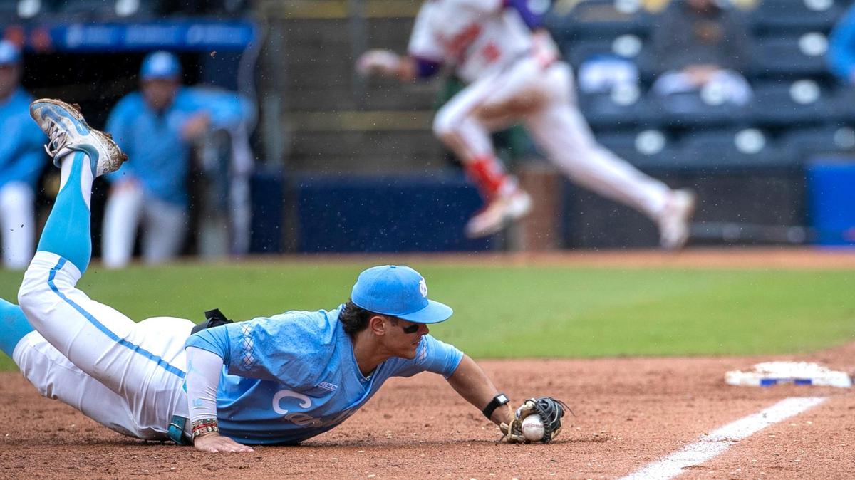 North Carolina third baseman Johnny Castagnozzi (19) fields a base hit by Clemson’s Will Taylor (16) down the third base line in the third inning, during the semi-finals of the 2023 ACC Baseball Championship on Saturday, May 27, 2023 at Durham Bulls Athletic Park in Durham, N.C.