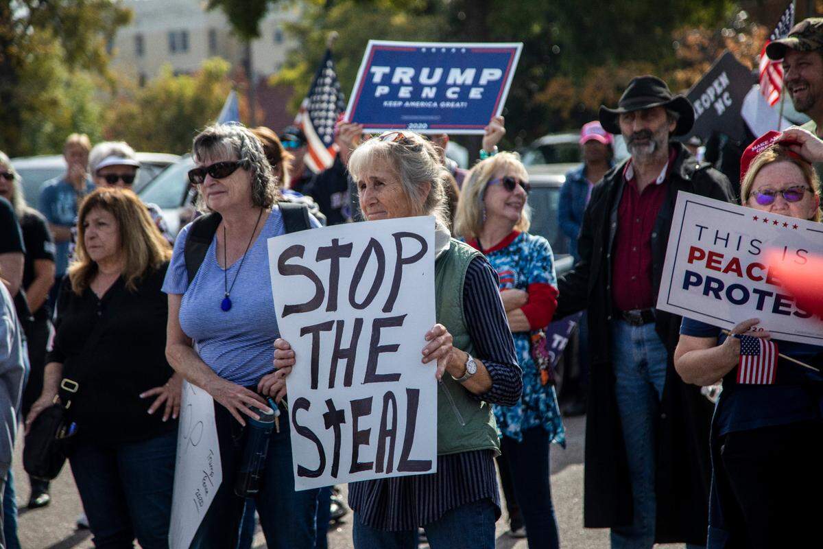 About 150 demonstrators fearing election fraud march and rally Friday, Nov. 6, 2020 near the North Carolina State Legislature.