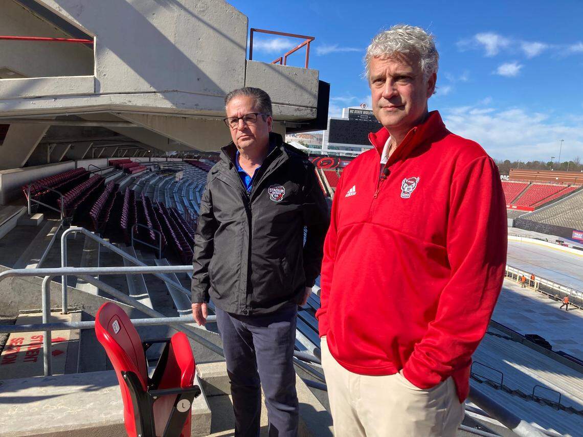 NC State athletic director Boo Corrigan, right, and Steve Mayer, event producer for the NHL, answer media questions Monday about the 2023 Stadium Series game at NC State’s Carter-Finley Stadium between the Carolina Hurricanes and Washington Capitals.