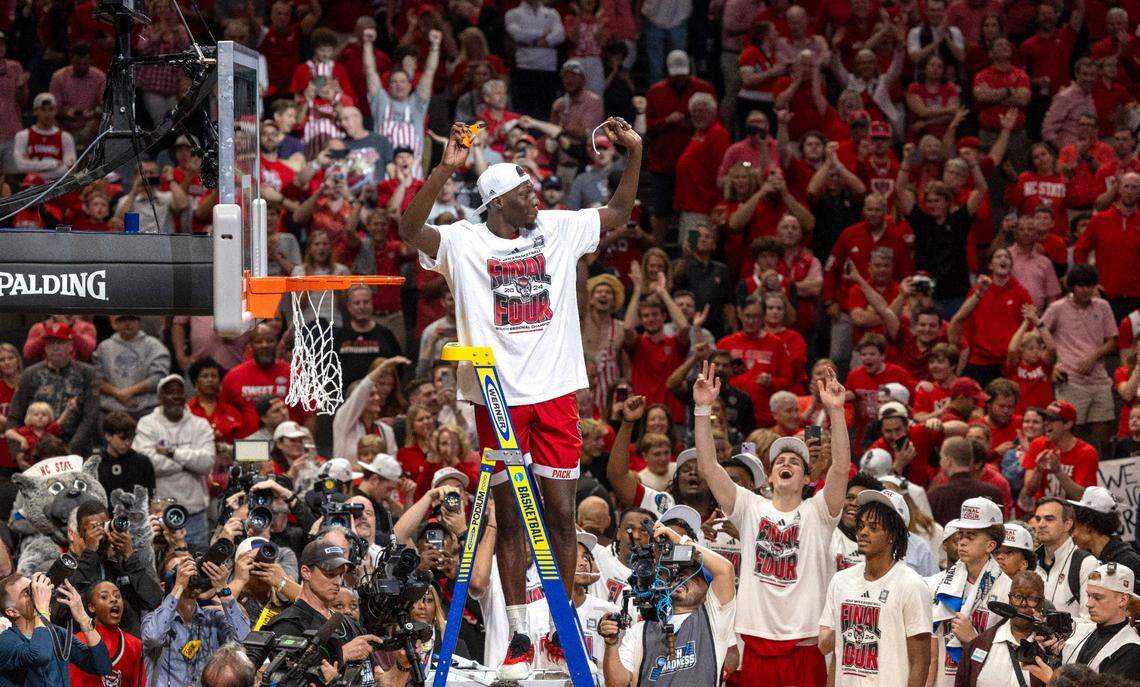 N.C. State’s Mohamed Diarra (23) acknowledges fans as he cuts down the net following the Wolfpack’s 76-64 victory over Duke, clinching the NCAA South Regional final and securing a spot in the Final Four on Sunday, March 31, 2024 at the American Airlines Center in Dallas, Texas.