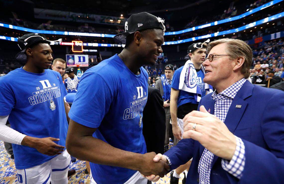 Duke president Vincent Price congratulates Zion Williamson (1) after Duke’s 73-63 victory over Florida State in the finals of the 2019 ACC Tournament in Charlotte, N.C., Saturday, March 16, 2019.