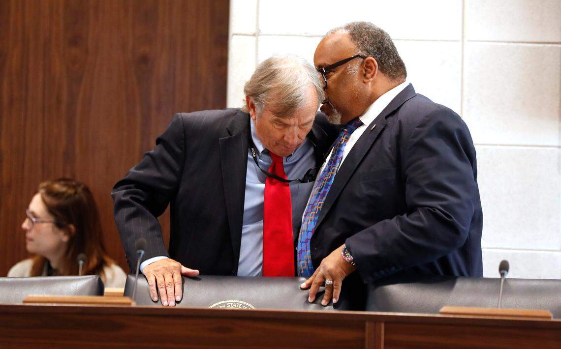 Sen. Paul Lowe, Jr., right, talks with Sen. Bill Rabon before a Senate Judiciary hearing about Senate Bill 711, the N.C. Compassionate Care Act, at the Legislative Building in Raleigh, N.C., Wednesday, June 30, 2021.