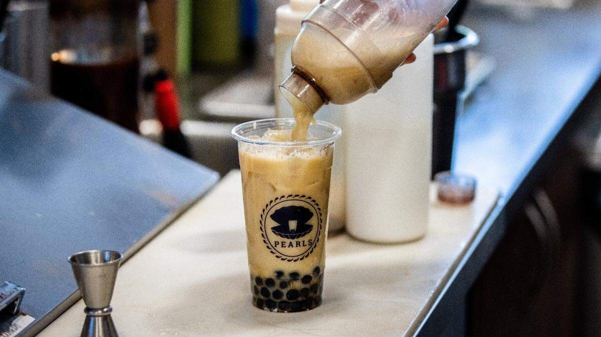 A worker makes a boba drink at Pearls Boba in Sacramento on Tuesday, April 20, 2021. Due to supply chain issues there is an international boba shortage.
