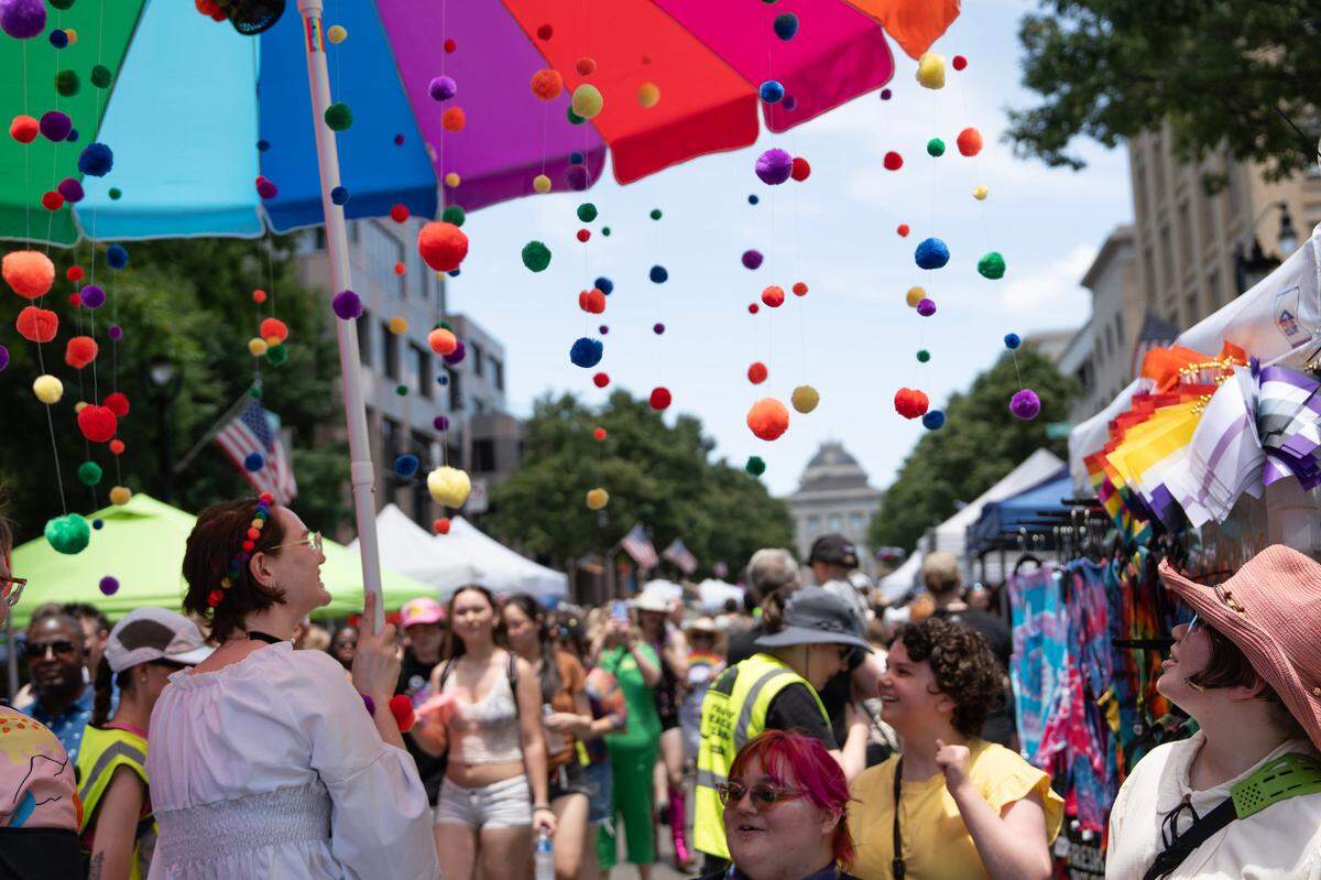 People gather to uplift the LGBTQ community during the Out! Raleigh Pride festival in downtown Raleigh Saturday, June 21, 2025.