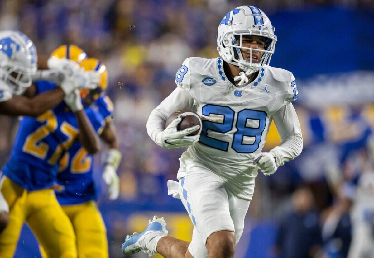 North Carolina’s Alijah Huzzie (28) returns a punt 52-yards for a touchdown in the second quarter to give the Tar Heels a 21-14 lead over Pitt in the second quarter on Saturday, September 23, 2023 at Acrisure Stadium in Pittsburgh, Pa.