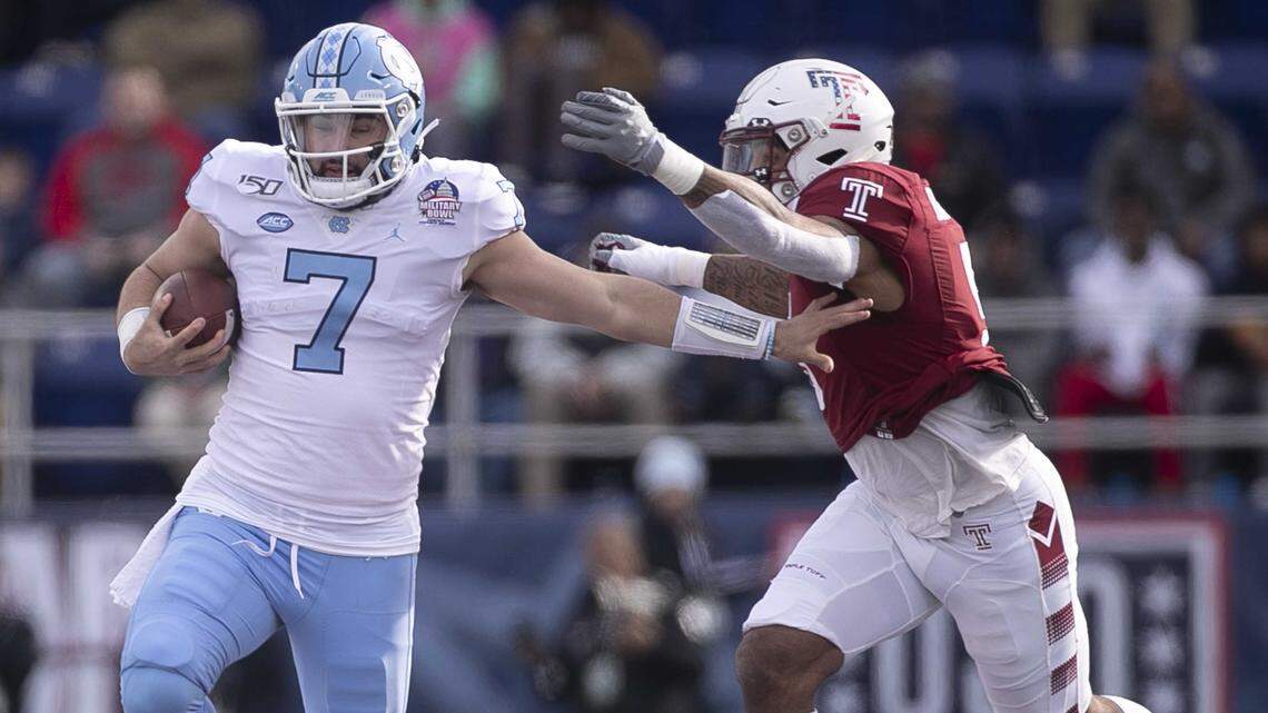North Carolina quarterback Sam Howell (7) rushes for 24 yards ahead of Temple’s Shaun Bradley (5) in the first quarter during the Military Bowl on Friday, December 27, 2019 at Navy-Marine Corps Memorial Stadium in Annapolis, Maryland. The attempt failed.