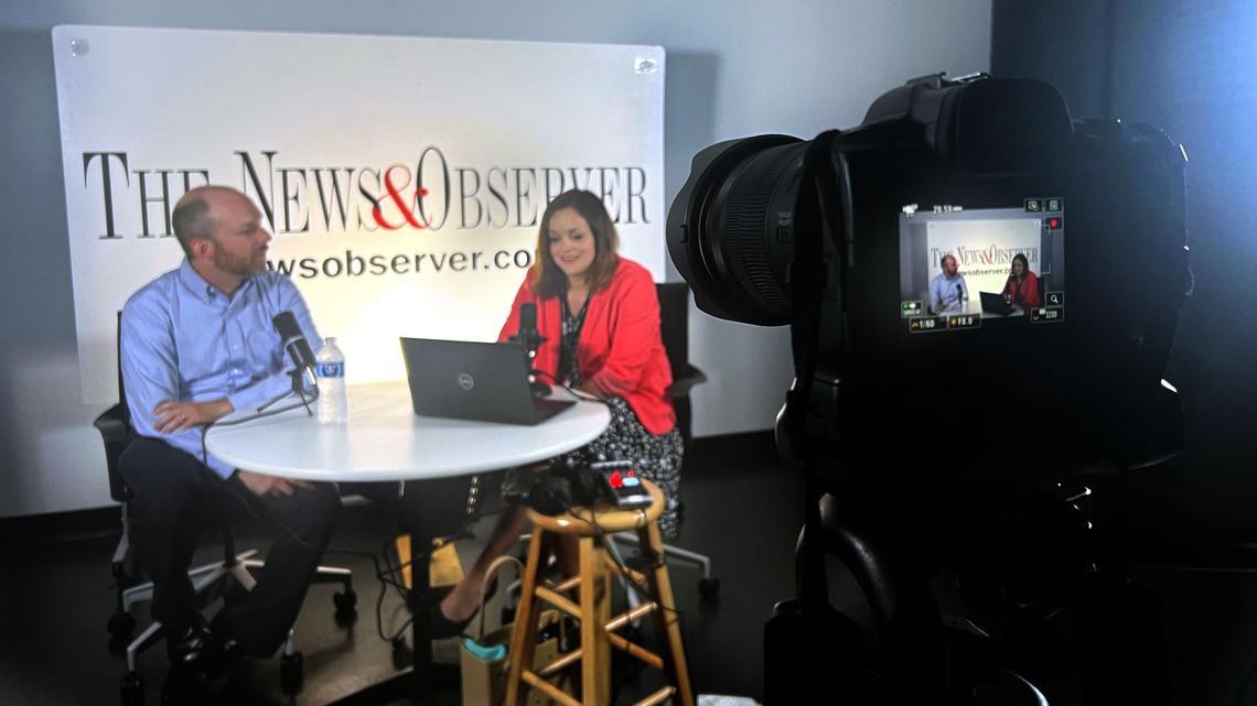 WUNC Capitol Bureau Chief Colin Campbell, left, talks with News & Observer Capitol Bureau Chief and Under the Dome podcast host Dawn Vaughan during a podcast recording at The N&O on Thursday, July 20,2023 in Raleigh.