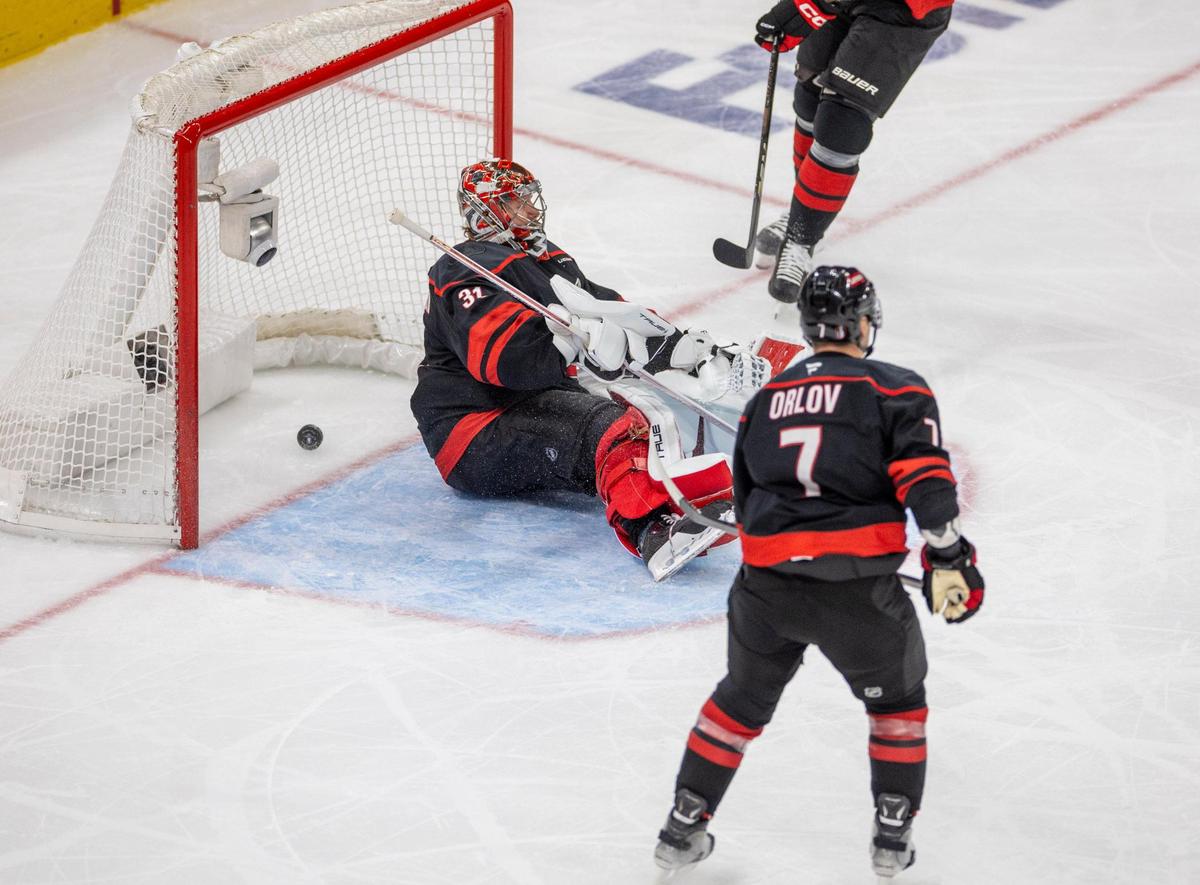 Carolina Hurricanes goalie Frederik Andersen (31) hits the ice after Florida Panthers center Evan Rodrigues (17) scored to tie the score 2-2 in the second period during Game 5 of their Stanley Cup series on Wednesday, May 28, 2025 at Lenovo Center in Raleigh, N.C.