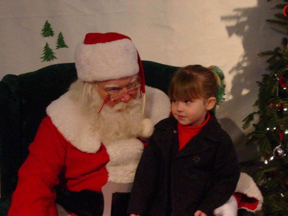 Alan Wolf’s daughter with Santa.