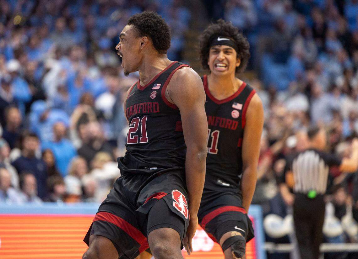 Stanford guard Jaylen Blakes (21) celebrates with teammate Ryan Agarwal (11) after sinking a two-point basket with :02 seconds to play to give Stanford a 72-71 victory over North Carolina on Saturday, January 18, 2025 at the Smith Center in Chapel Hill, N.C. Blakes, a former Duke guard, said after the game, ‘I was overjoyed’, as he made the rounds looking at the dejected fans in the Smith Center.