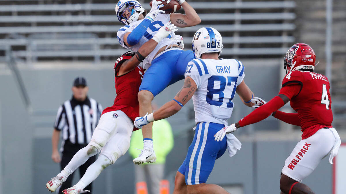 Duke wide receiver Jake Bobo (19) makes the reception as N.C. State safety Tanner Ingle (10) defends during the first half of N.C. State’s game against Duke at Carter-Finley Stadium in Raleigh, N.C., Saturday, Oct. 17, 2020.