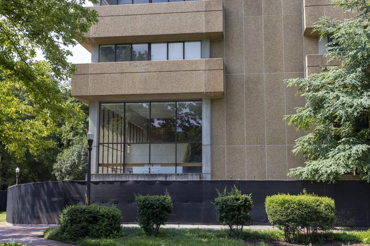 Fencing surrounds Poe Hall on the N.C. State campus on Wednesday, July 8, 2026 in Raleigh, N.C. The structure was closed in 203 after high levels of PCB's, toxic chemicals that have been linked to health issues including cancer are found in the building.