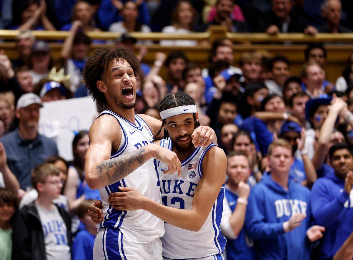 Duke’s Dereck Lively II hugs Jacob Grandison after scoring and being fouled during the second half of the Blue Devils’ 81-65 win over Virginia Tech on Saturday, Feb. 25, 2023, at Cameron Indoor Stadium in Durham, N.C.