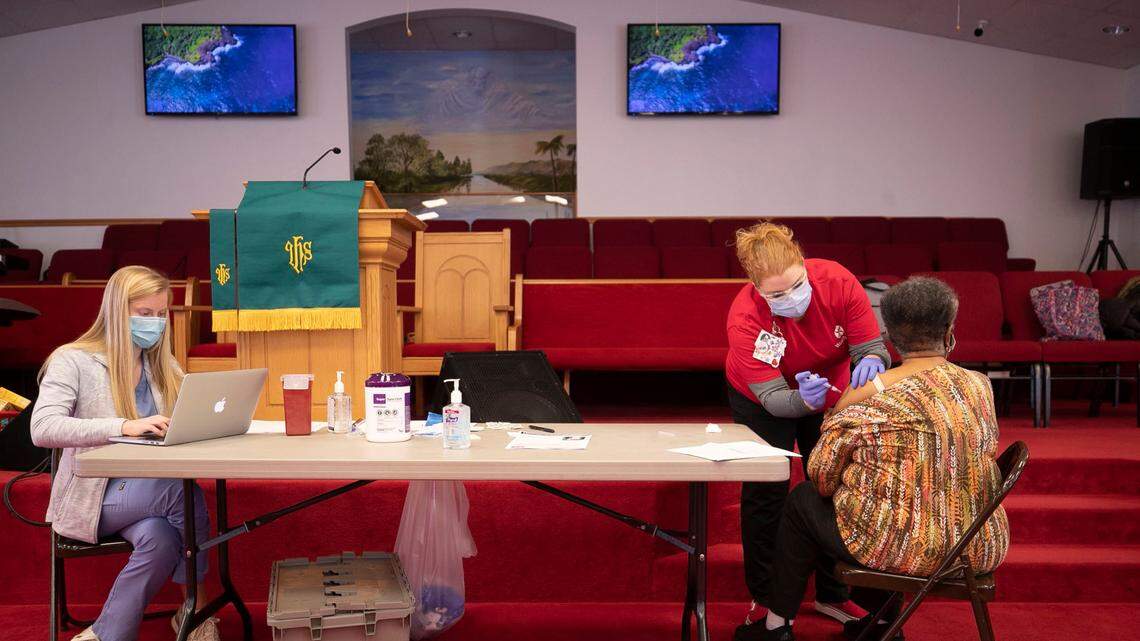 Pearline Fowler receives her first dose of the COVID-19 vaccine during an immunization clinic in the sanctuary of New Bethel Christian Church on Saturday, February 6, 2021 in Raleigh, N.C.
