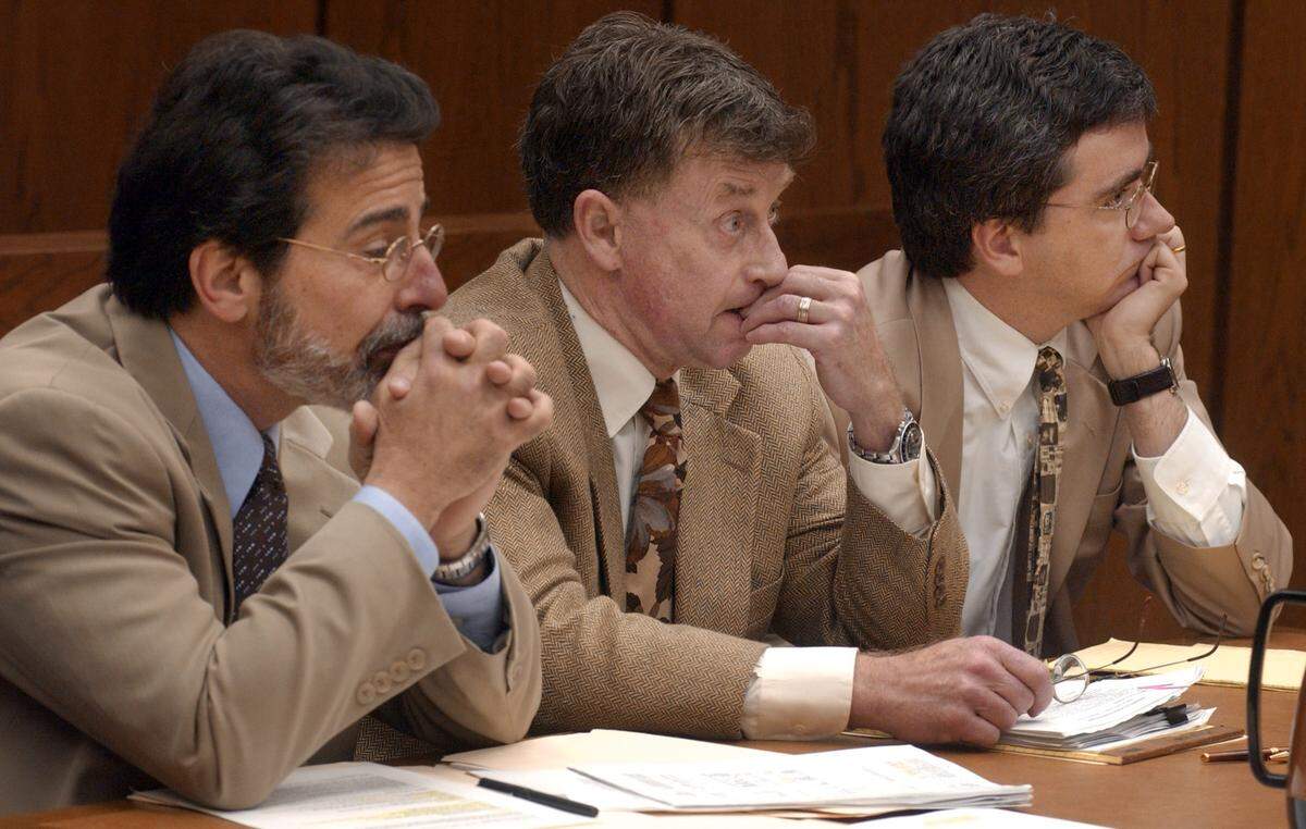 Attorney David Rudolf, defendant Michael Peterson and attorney Thomas Maher listen to Superior Court Judge Orlando Hudson as the fifth week of jury selection came to a close Friday in Peterson’s murder trial.
