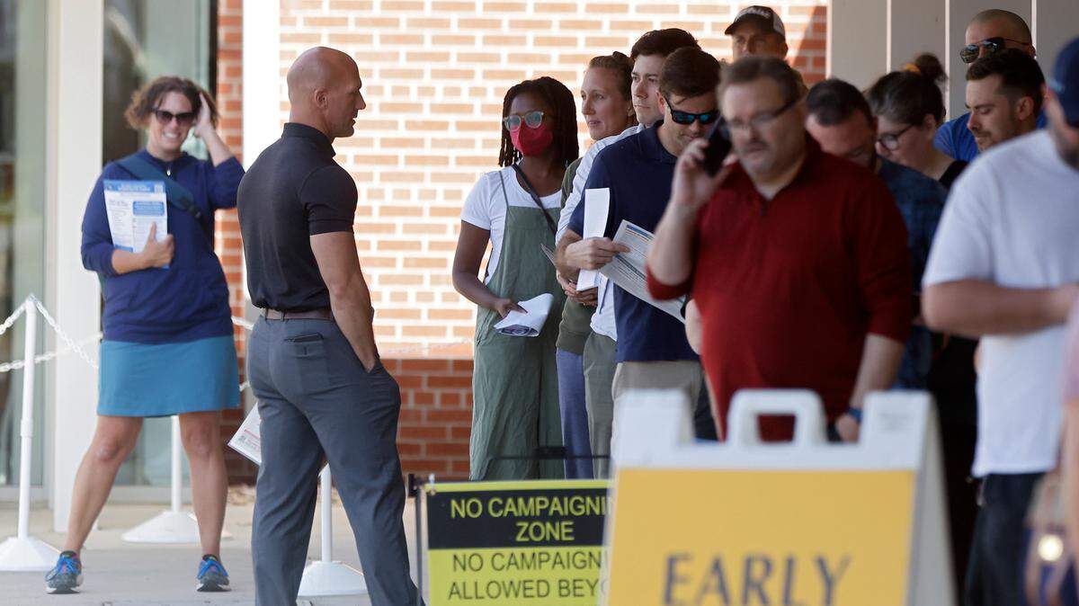 Wearing political items at the polls is a “First Amendment right,” according to a Meck County BOE representative, but doing so could lead to trouble.
