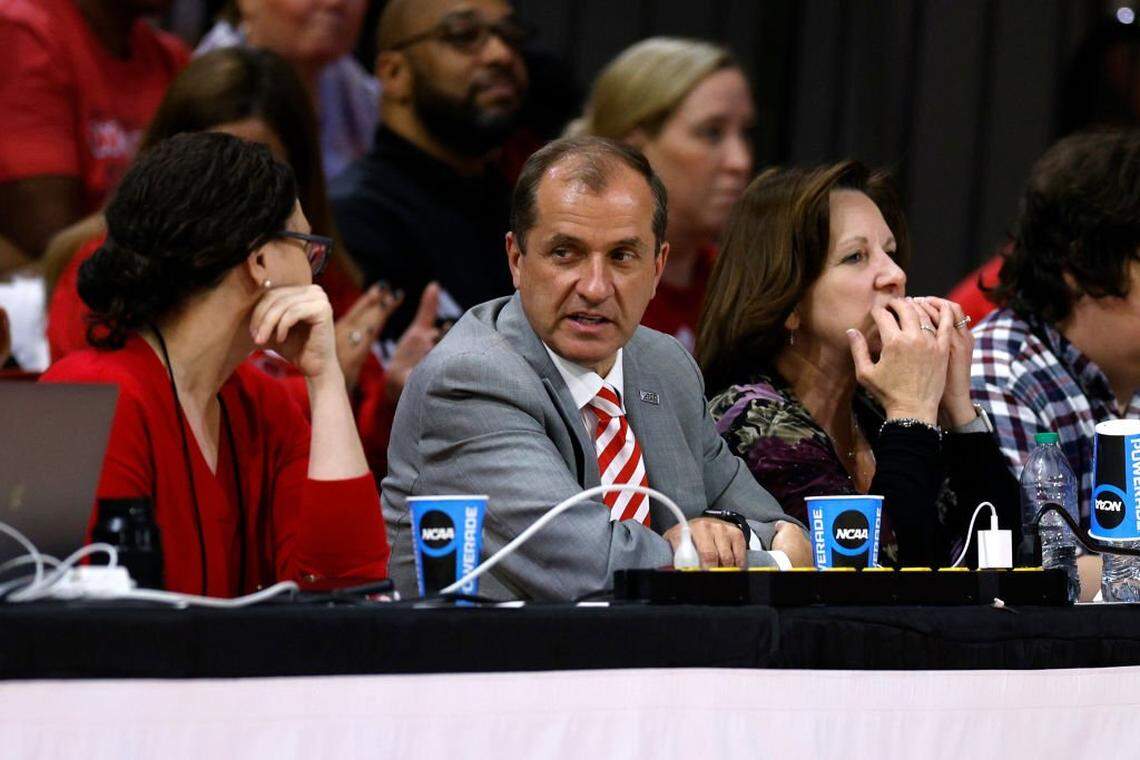 ACC Commissioner Jim Phillips (C) attends the game between the Tennessee Lady Vols and the NC State Wolfpack in the second round of the NCAA Women's Basketball Tournament at Reynolds Coliseum on March 25, 2024 in Raleigh, North Carolina. 