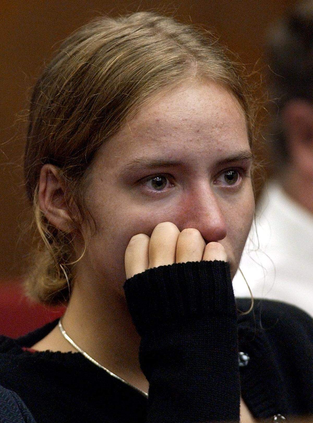 Martha Ratliff listens to witness Cheryl Appel-Schumacher describe the death of Ratliff’s mother, Elizabeth Ratliff, during a hearing Wednesday, Aug. 20, 2003, in Durham, N.C. The hearing is to determine if evidence in the death of Elizabeth Ratliff in Germany in 1985 will be allowed to be introduced in the murder trial of Michael Peterson, who is charged in the death of his wife, Kathleen Peterson. He is also the legal guardian of Martha Ratliff.
