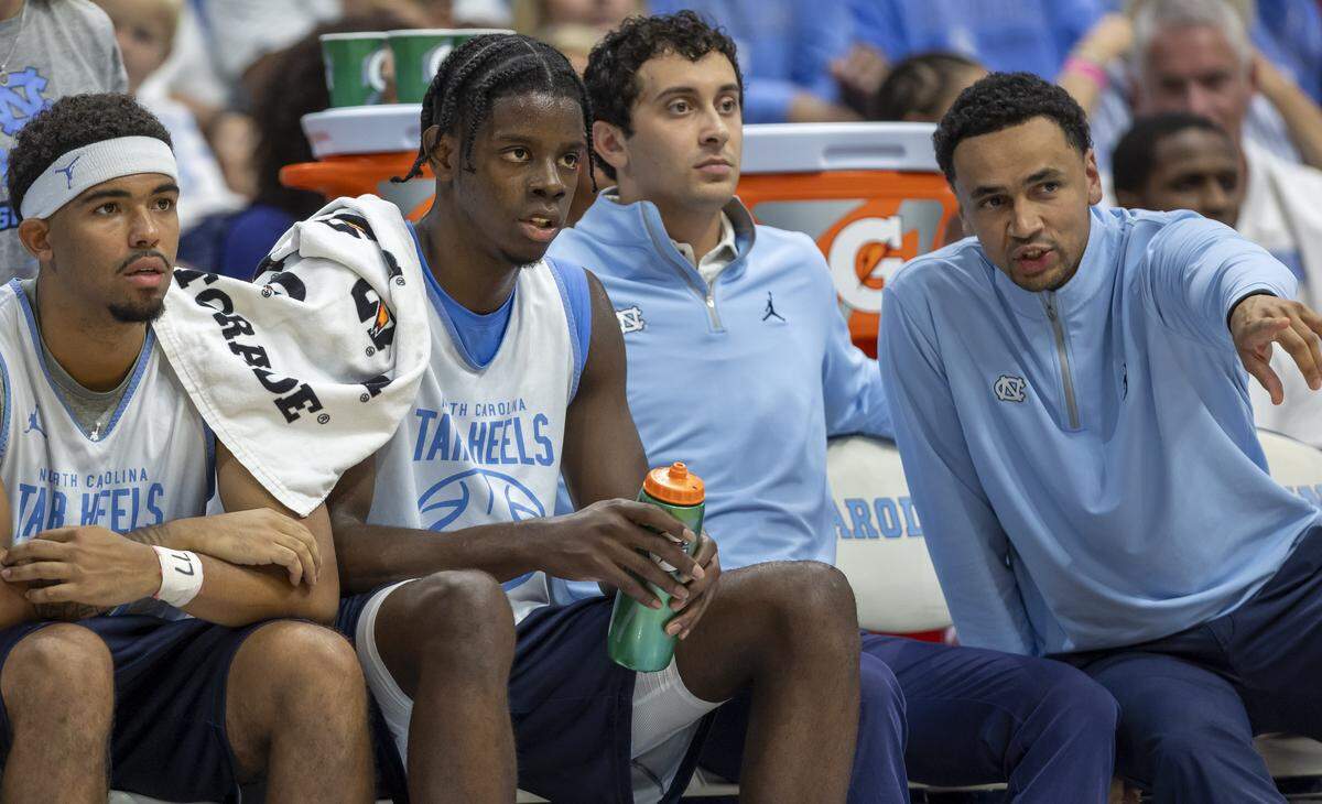 North Carolina assistant coach Marcus Paige talks with North Carolina forward Caleb Wilson (8) during the Blue-White scrimmage on Saturday, October 4, 2025 at the Smith Center in Chapel Hill, N.C.