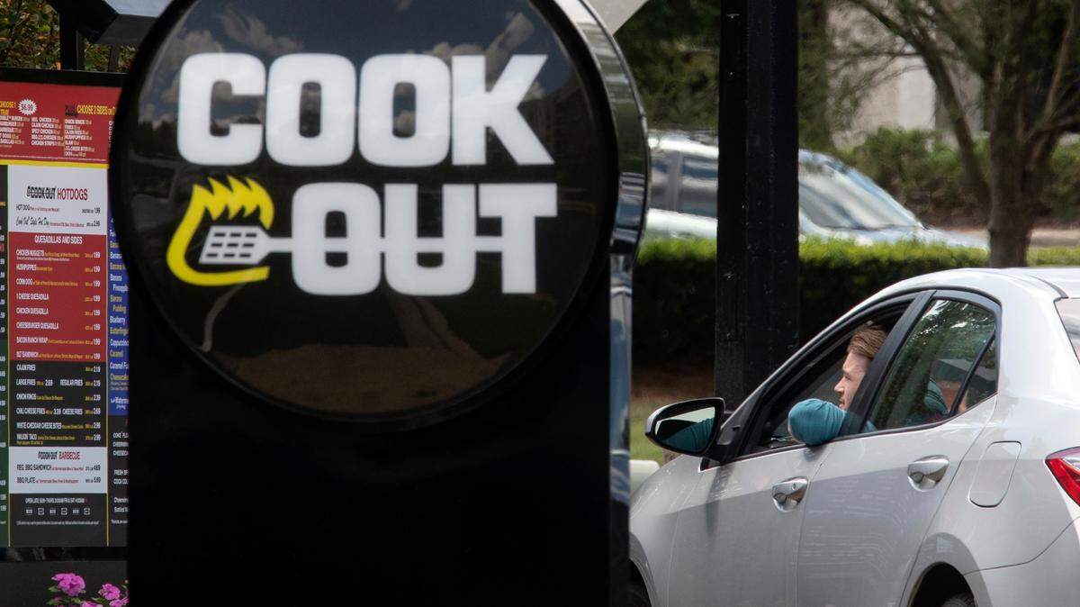 A customer orders at the drive-thru of a new Cook Out on Elliot Road in Chapel Hill, N.C. on Monday, Sept. 12, 2022.
