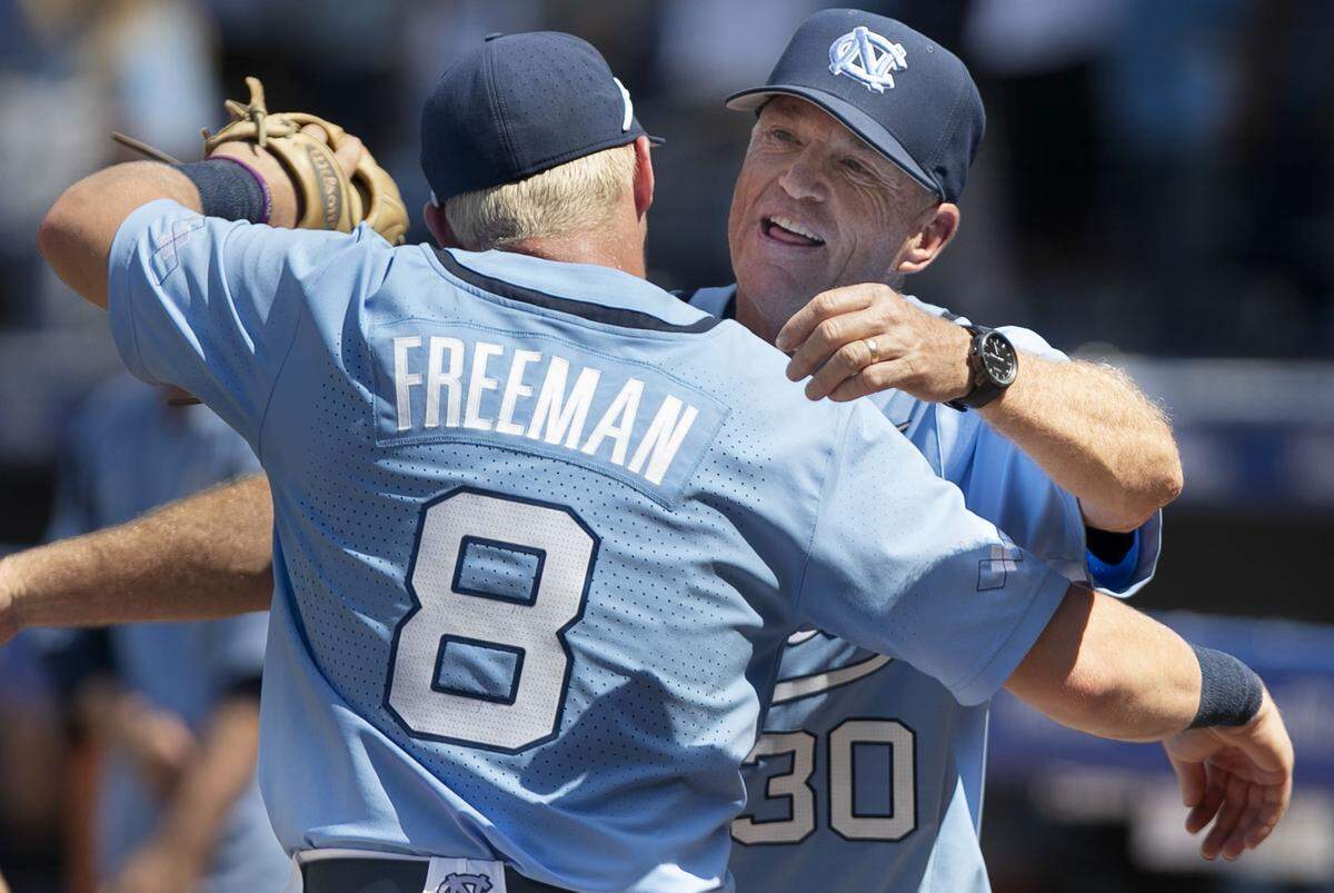 North Carolina third baseman Ike Freeman (8) embraces head coach Mike Fox after the Tar Heels’ clinched the ACC Baseball Championship with a 10-2 victory over Georgia Tech on Sunday, May 26, 2019 at Durham Bulls Athletic Park in Durham, N.C.