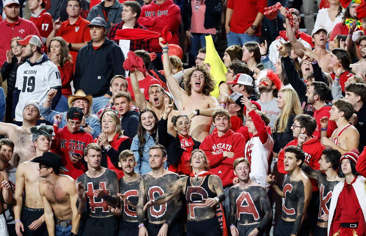 Fans cheer on the Wolfpack during the second half of N.C. State’s 22-21 victory over Virginia Tech at Carter-Finley Stadium in Raleigh, N.C., Thursday, Oct. 27, 2022.